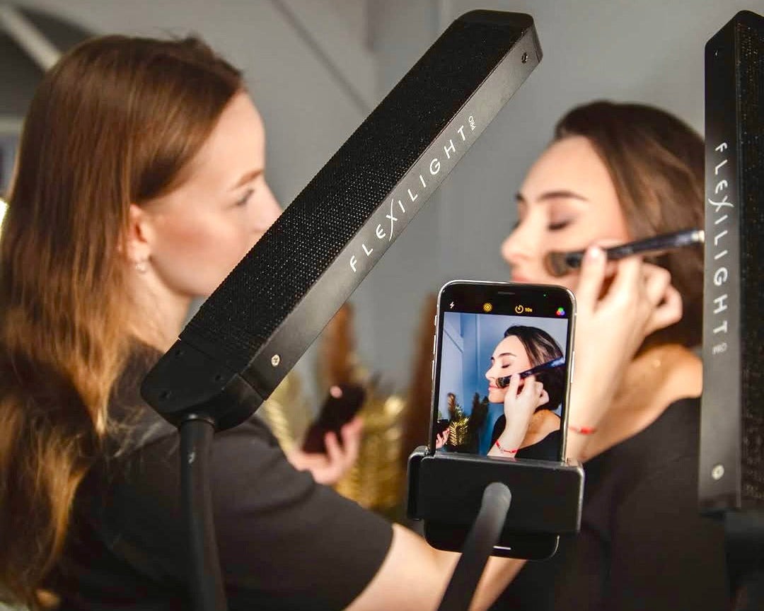 Person using a Fleshlight device with a smartphone camera to take a photo.